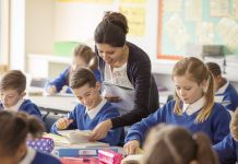 Female teacher with her pupils in classroom