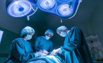 Team of surgeon doctors are performing heart surgery operation for patient from organ donor to save more life in emergency surgical room